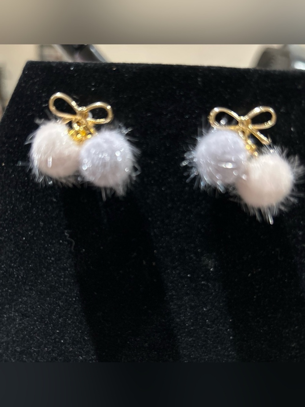 Gold color Bow Pom Pom Stud Earrings in Pale Pink and Light Gray